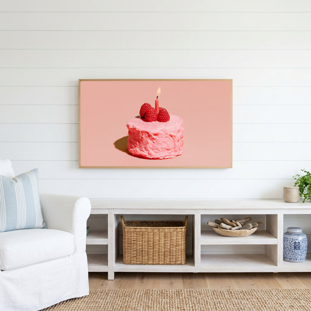 Birthday cake Frame TV art above a white console with a rattan basket in a coastal living room