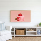 Birthday cake Frame TV art above a white console with a rattan basket in a coastal living room