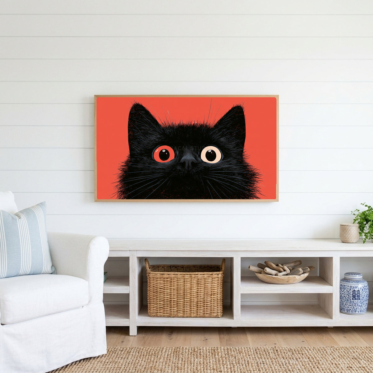 Black cat with big eyes Frame TV art above a white console with a rattan basket in a coastal living room