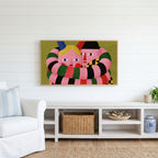 Long striped arms portrait Frame TV art above a white console with a rattan basket in a coastal living room