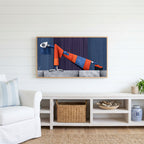 Surreal leaning woman Frame TV art above a white console with a rattan basket in a coastal living room