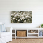 White anemone field Frame TV art above a white console with a rattan basket in a coastal living room
