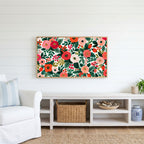Painted roses and berries Frame TV art above a white console with a rattan basket in a coastal living room