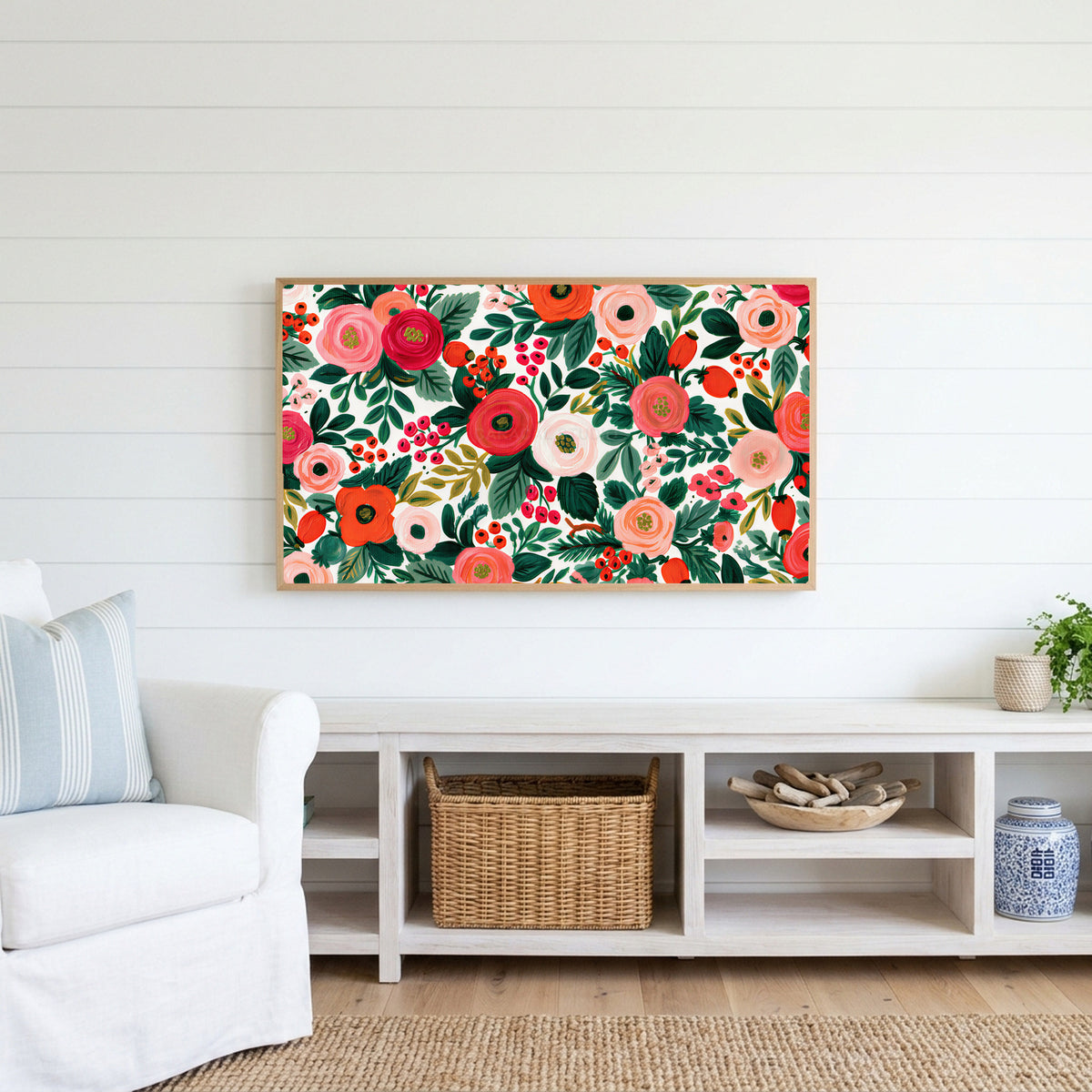Painted roses and berries Frame TV art above a white console with a rattan basket in a coastal living room