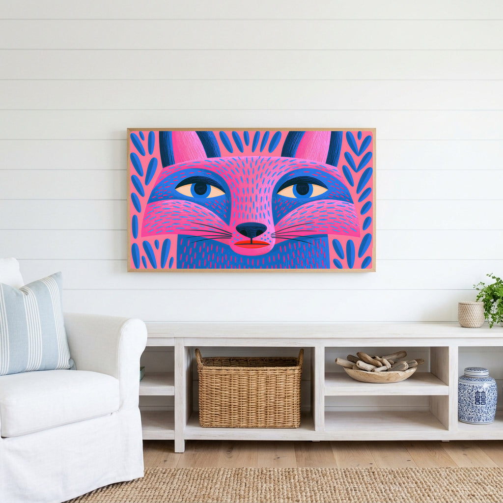 Pink folk art fox Frame TV art above a white console with a rattan basket in a coastal living room