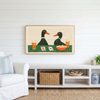 Ducks playing poker Frame TV art above a white console with a rattan basket in a coastal living room
