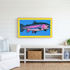Rainbow trout Frame TV art above a white console with a rattan basket in a coastal living room