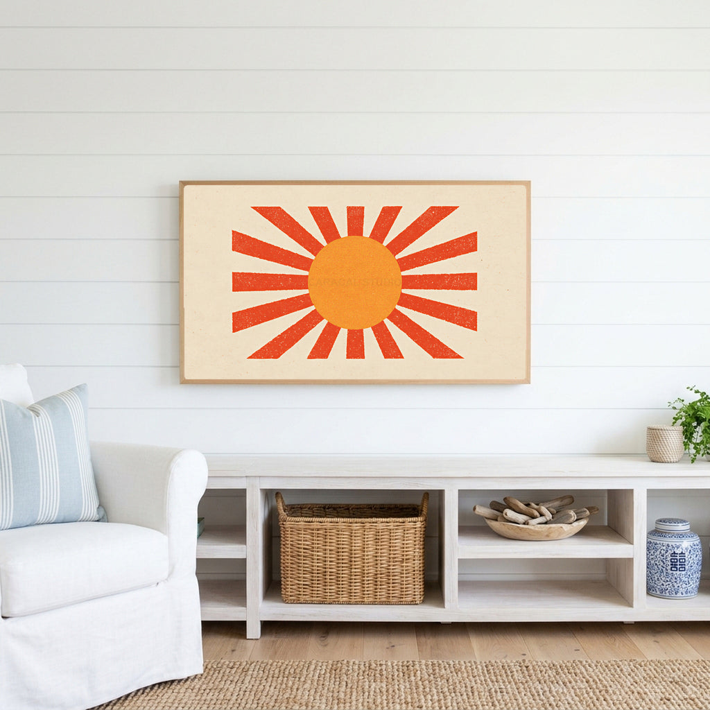 Retro sunburst Frame TV art above a white console with a rattan basket in a coastal living room