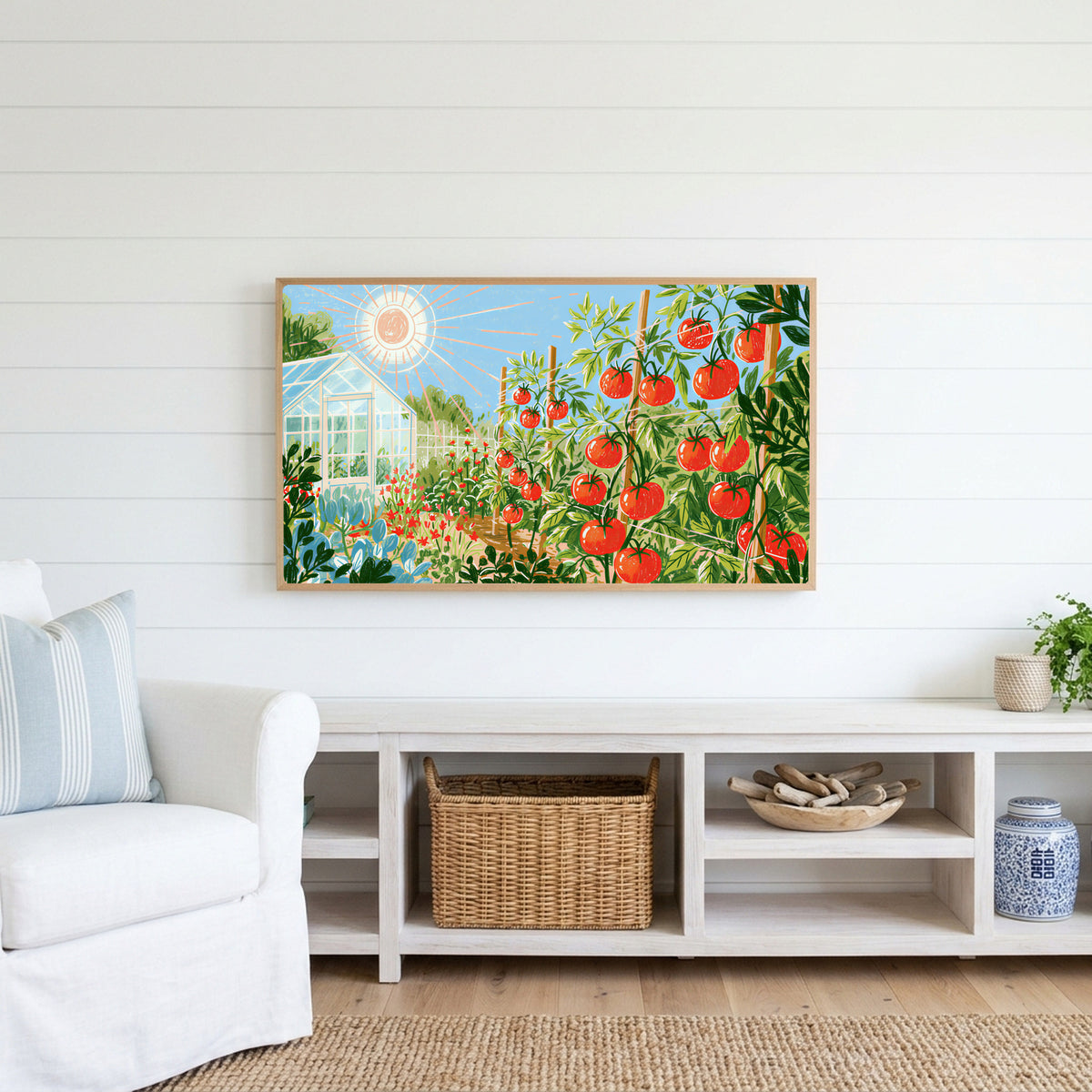Tomato garden Frame TV art above a white console with a rattan basket in a coastal living room