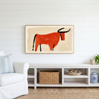 Minimalist bull Frame TV art above a white console with a rattan basket in a coastal living room