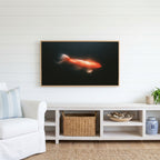 Glowing koi Frame TV art above a white console with a rattan basket in a coastal living room