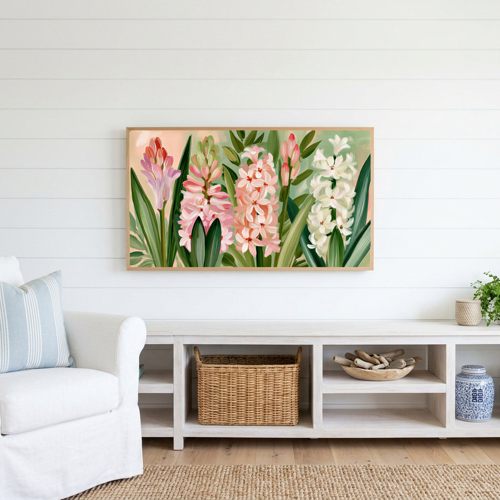 Spring hyacinths Frame TV art above a white console with a rattan basket in a coastal living room