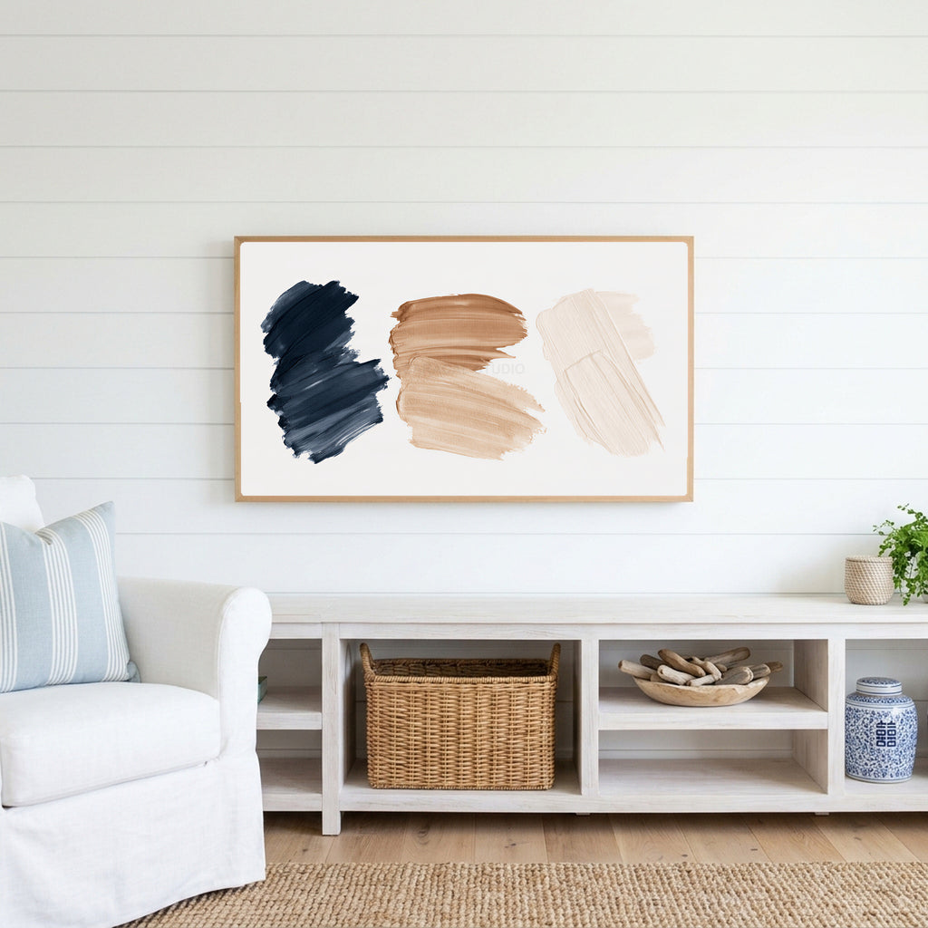 Paint stroke Frame TV art above a white console with a rattan basket in a coastal living room