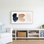 Paint stroke Frame TV art above a white console with a rattan basket in a coastal living room