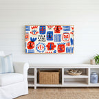 Doodle faces Frame TV art above a white console with a rattan basket in a coastal living room