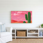 Saguaro cactus Frame TV art above a white console with a rattan basket in a coastal living room