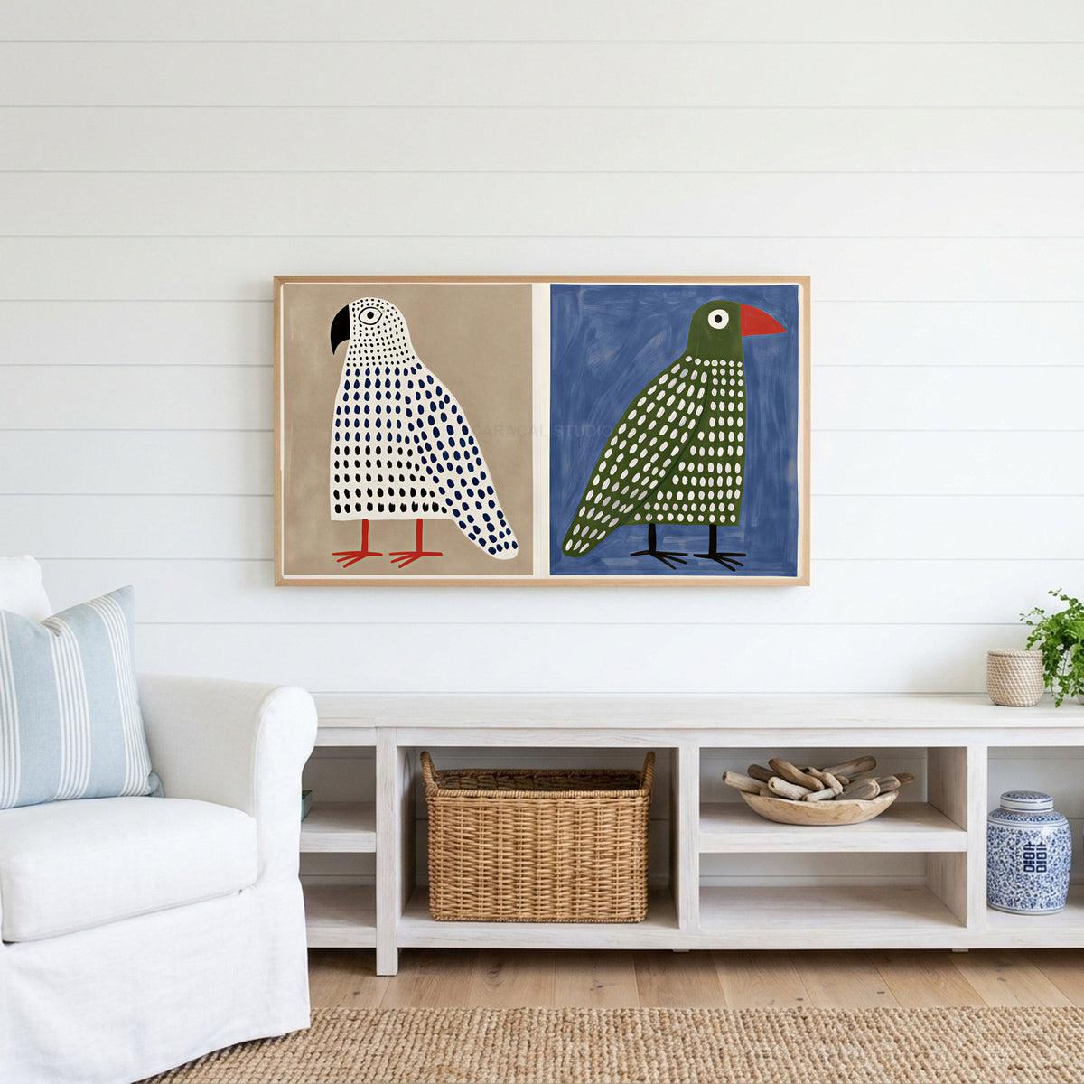 Polka dot birds Frame TV art above a white console with a rattan basket in a coastal living room