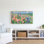 Poppy field Frame TV art above a white console with a rattan basket in a coastal living room