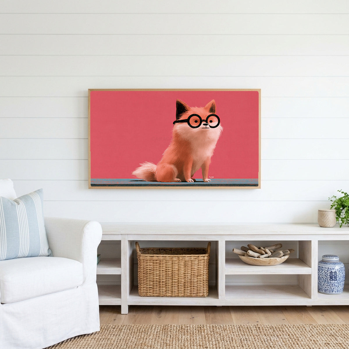 Dog in glasses Frame TV art above a white console with a rattan basket in a coastal living room