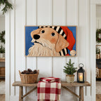 Golden retriever in a Santa hat Frame TV art above a rustic bench with pine cones and a red check blanket on a white plank wall