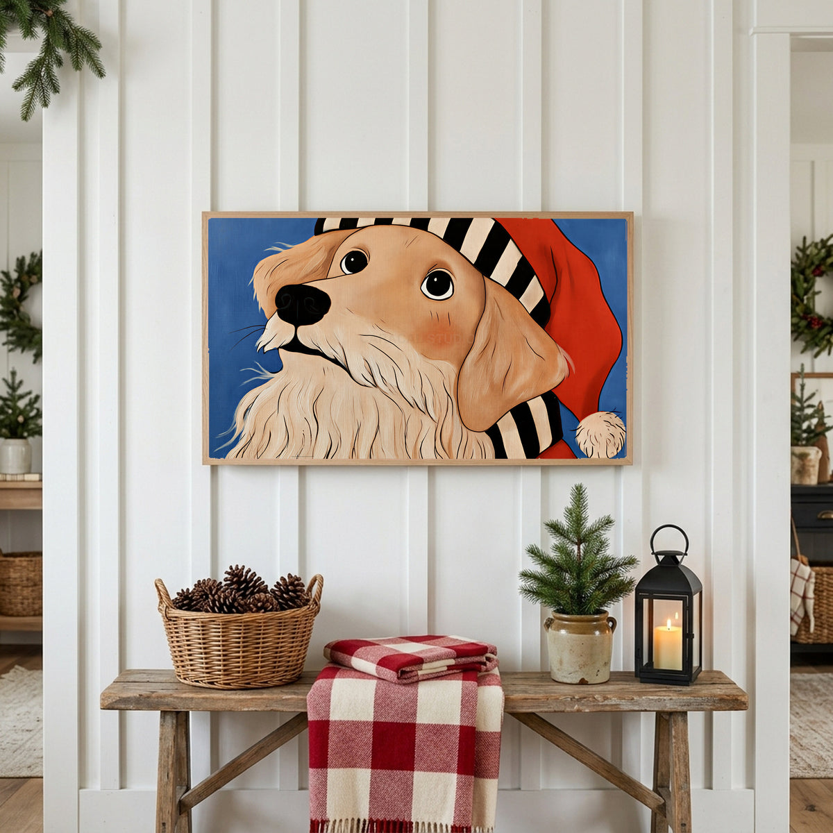 Golden retriever in a Santa hat Frame TV art above a rustic bench with pine cones and a red check blanket on a white plank wall