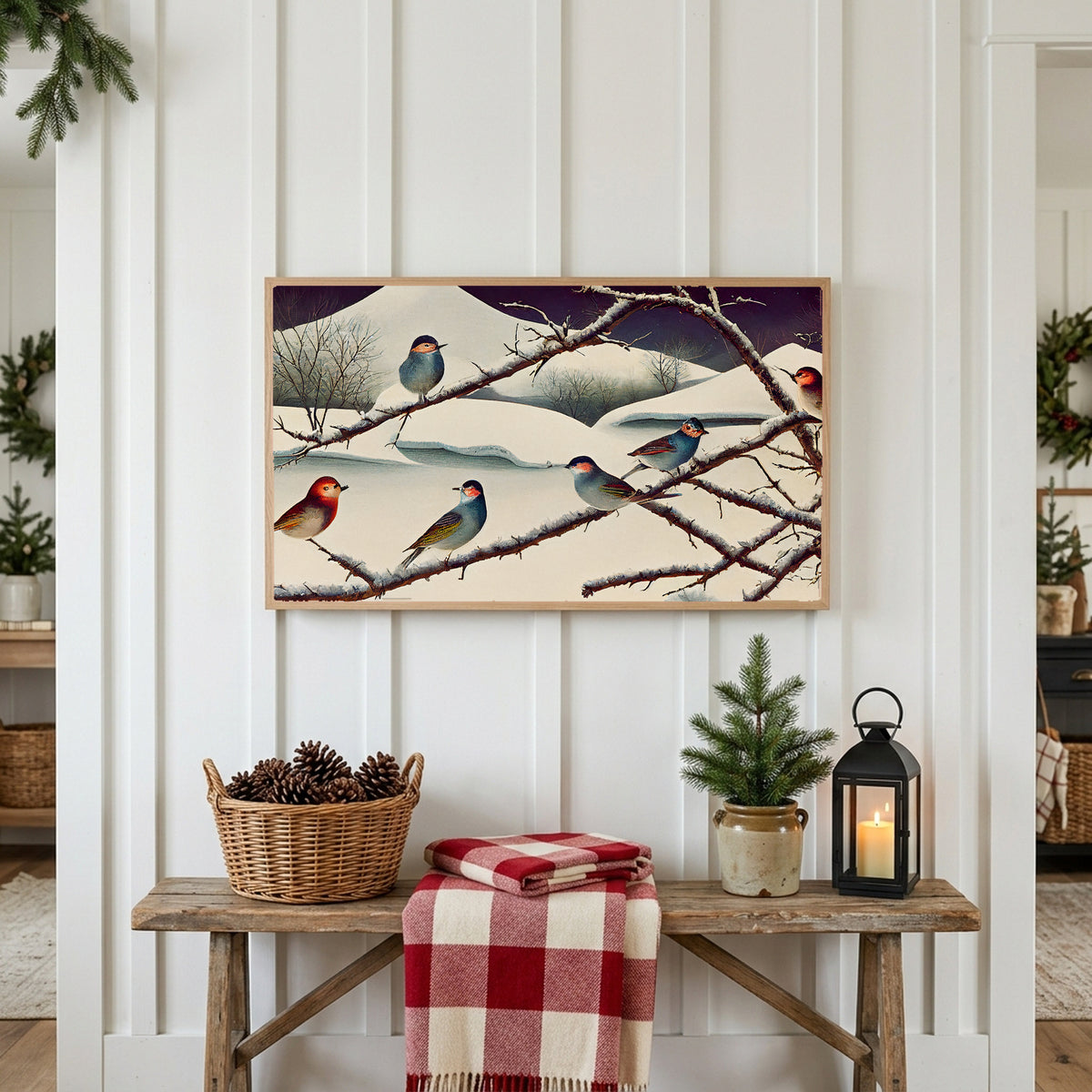 Winter Frame TV art above a rustic bench with pine cones and a red check blanket on a white plank wall
