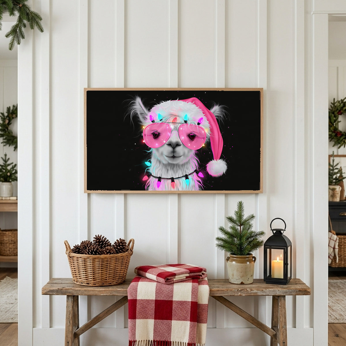Llama in a Santa hat Frame TV art above a rustic bench with pine cones and a red check blanket on a white plank wall