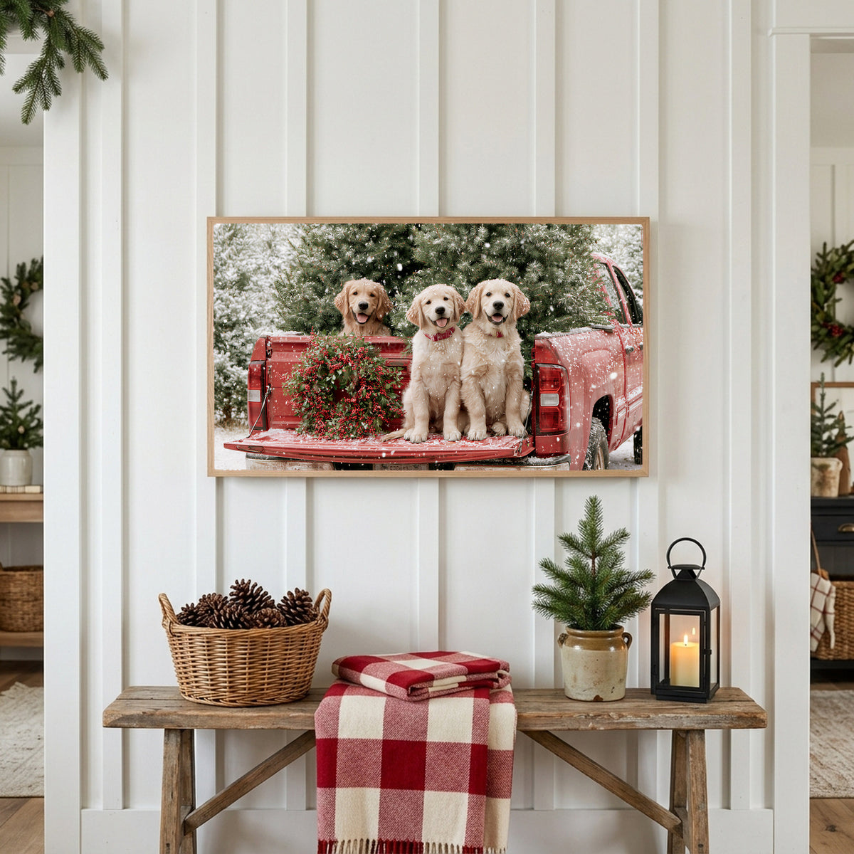 Christmas puppies Frame TV art above a rustic bench with pine cones and a red check blanket on a white plank wall