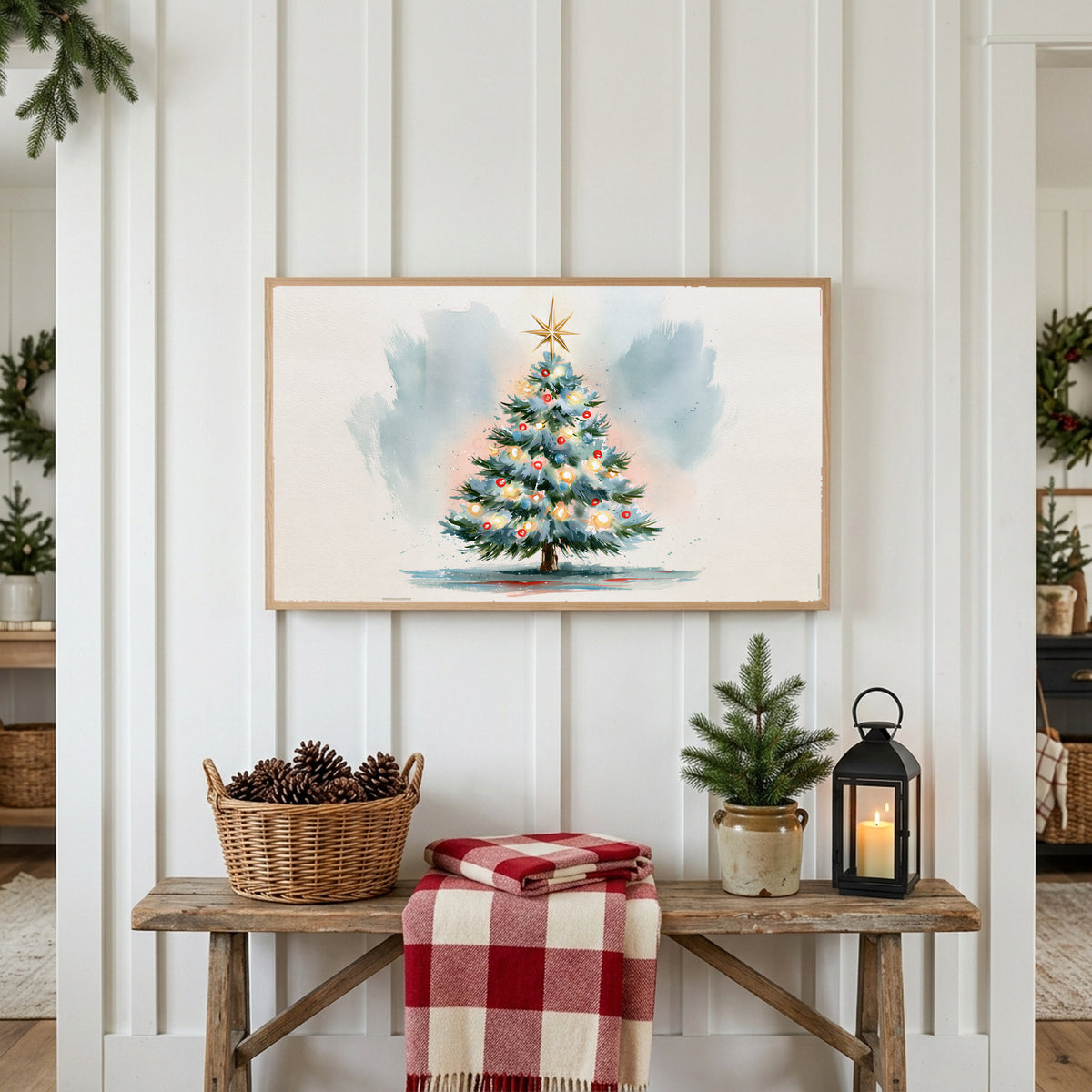 Watercolor Christmas tree Frame TV art above a rustic bench with pine cones and a red check blanket on a white plank wall