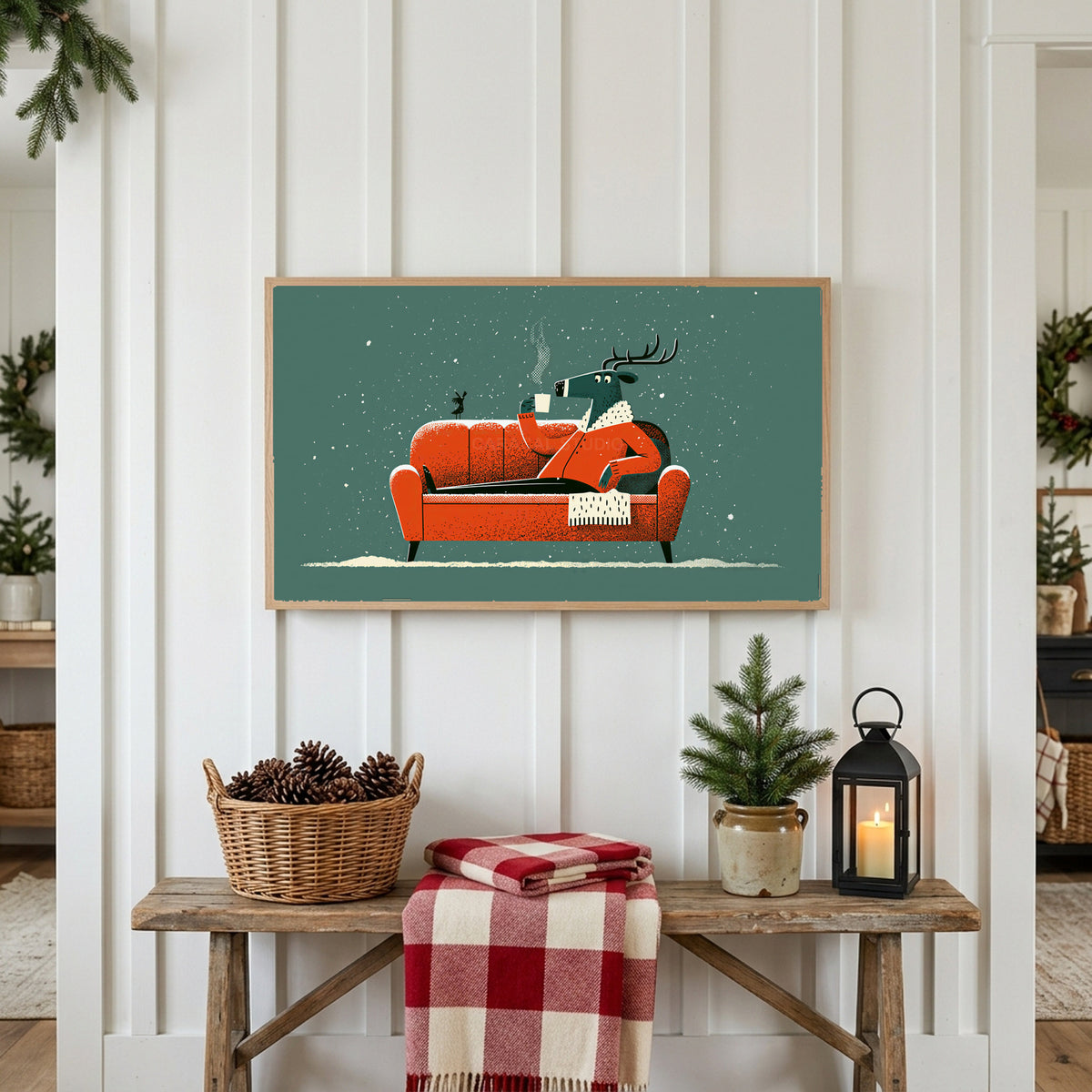 Reindeer on a sofa Frame TV art above a rustic bench with pine cones and a red check blanket on a white plank wall