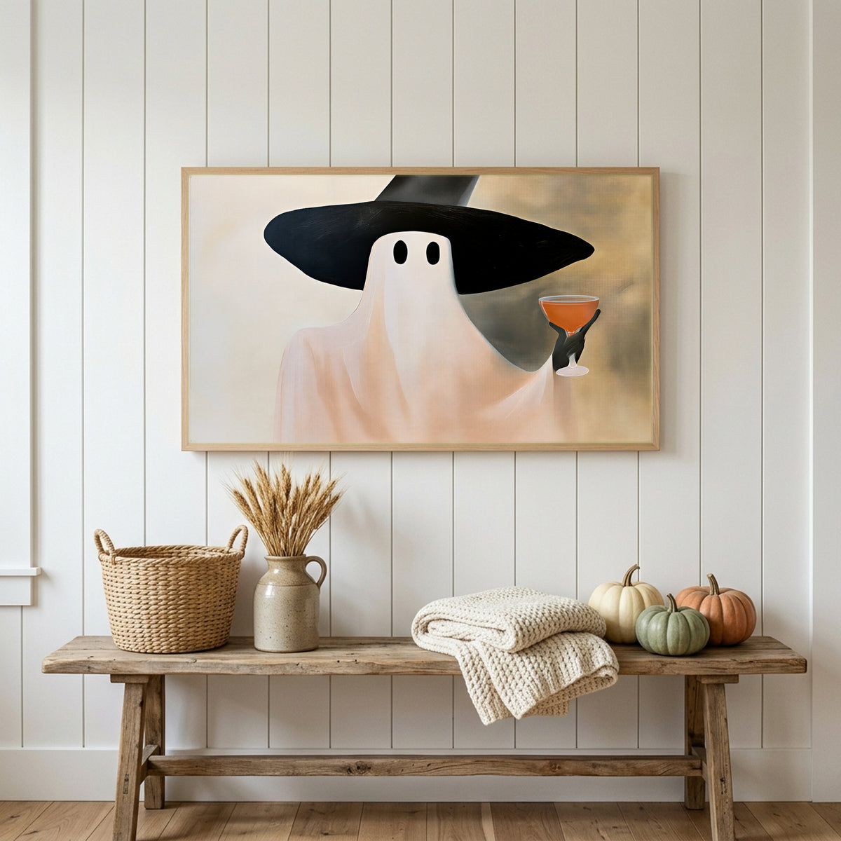 Halloween Frame TV art above a rustic bench with heirloom pumpkins on a white plank wall