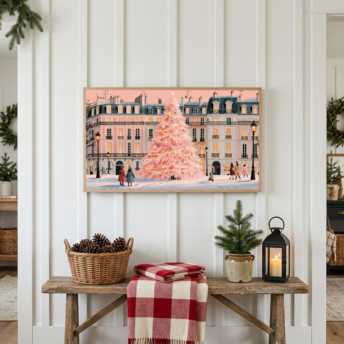 Paris pink Christmas tree Frame TV art above a rustic bench with pine cones and a red check blanket on a white plank wall