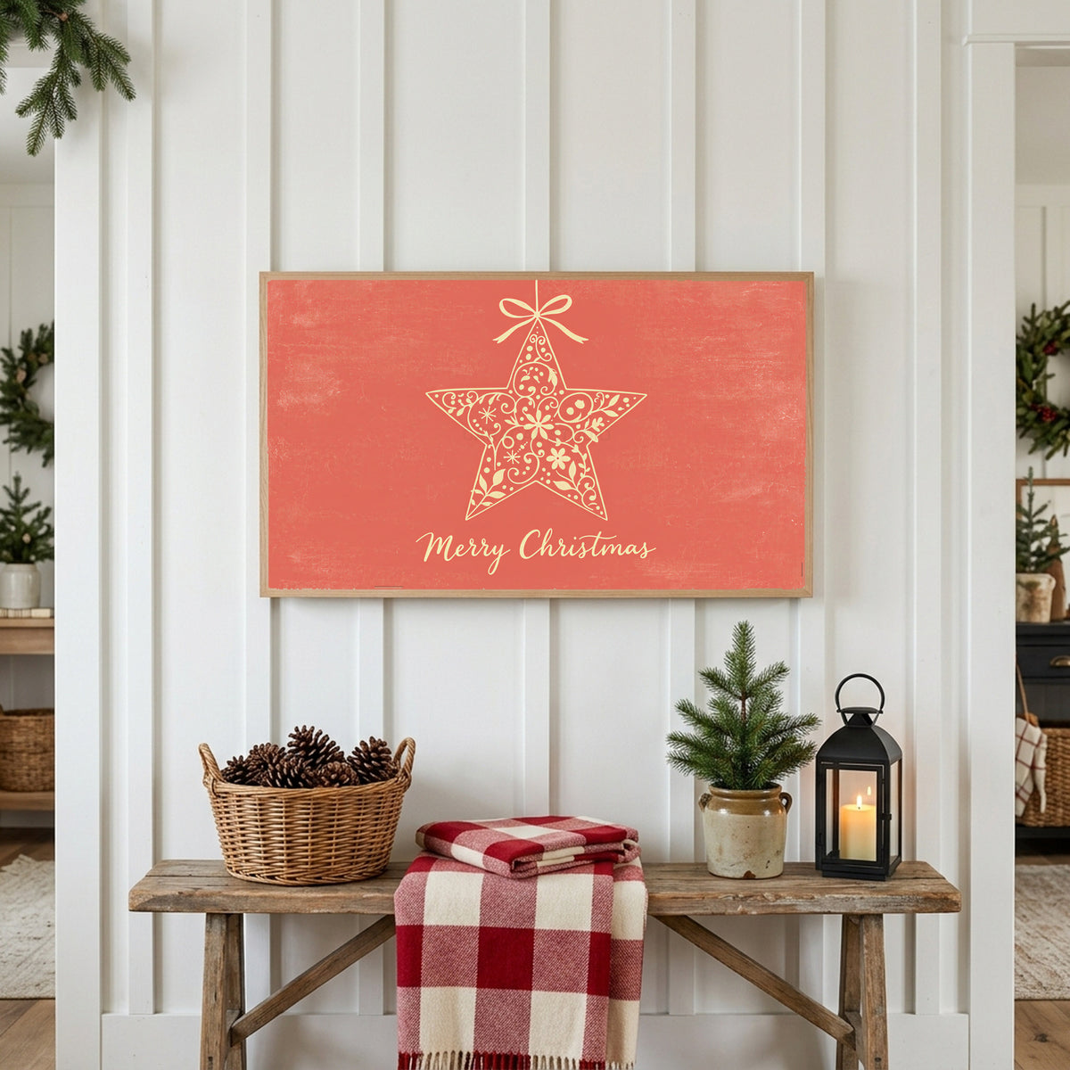 Star ornament Frame TV art above a rustic bench with pine cones and a red check blanket on a white plank wall