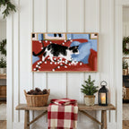 Christmas Frame TV art above a rustic bench with pine cones and a red check blanket on a white plank wall