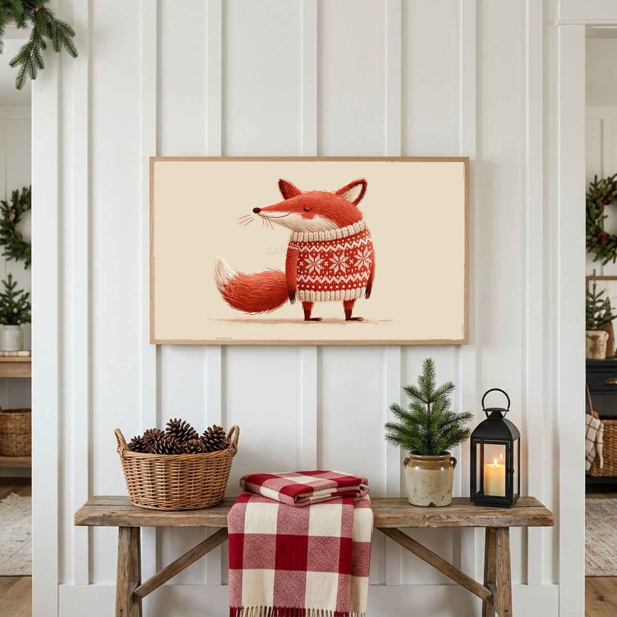Fox in a holiday sweater Frame TV art above a rustic bench with pine cones and a red check blanket on a white plank wall