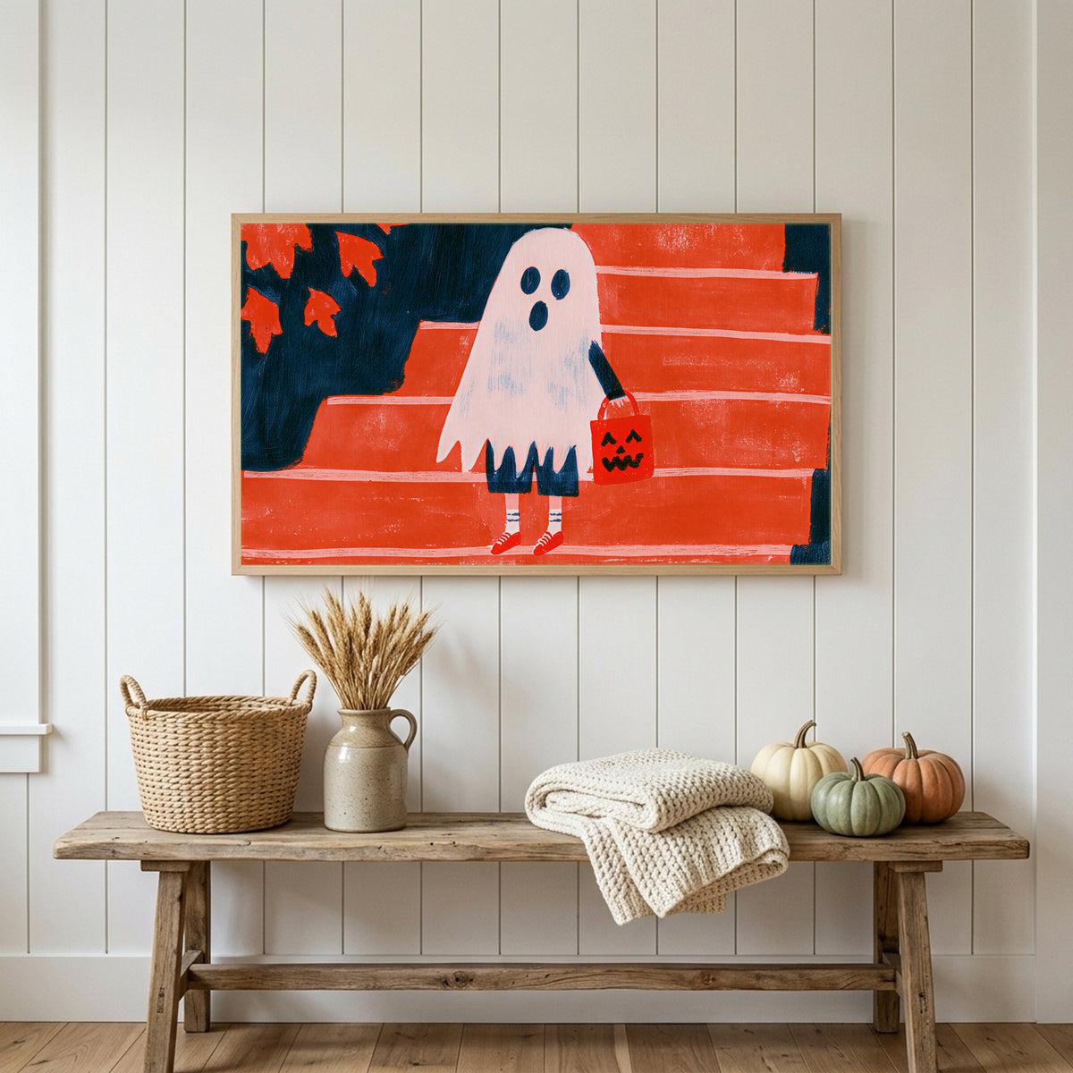 Halloween Frame TV art above a rustic bench with heirloom pumpkins on a white plank wall