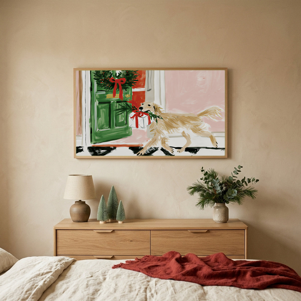 Labrador with a Christmas present Christmas TV art above an oak dresser with small bottle-brush trees in a calm bedroom