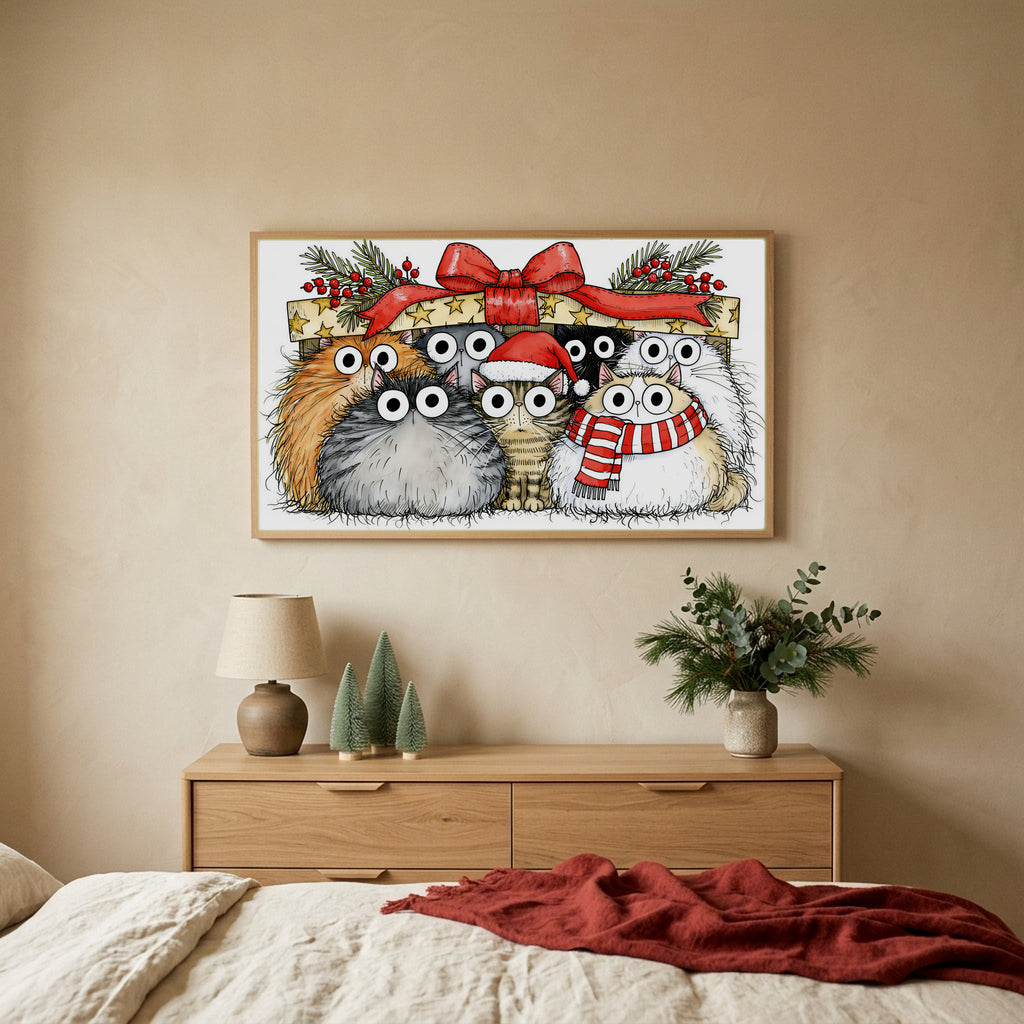Cats under a gift box TV art above an oak dresser with small bottle-brush trees in a calm bedroom