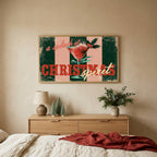Christmas cocktail typography TV art above an oak dresser with small bottle-brush trees in a calm bedroom