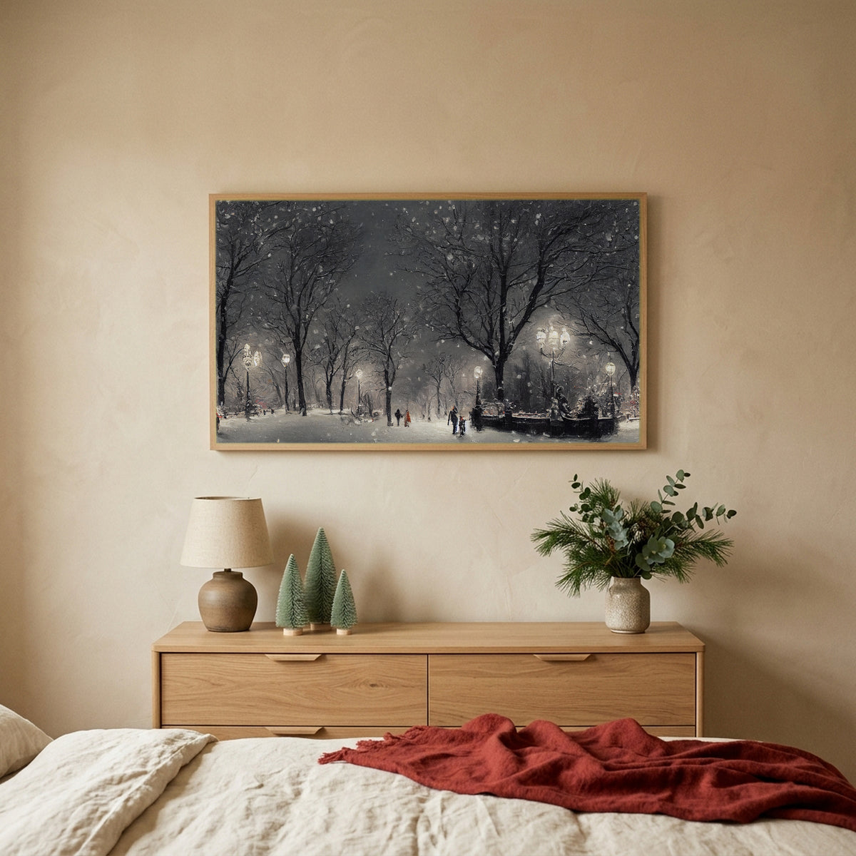 New York park at night TV art above an oak dresser with small bottle-brush trees in a calm bedroom
