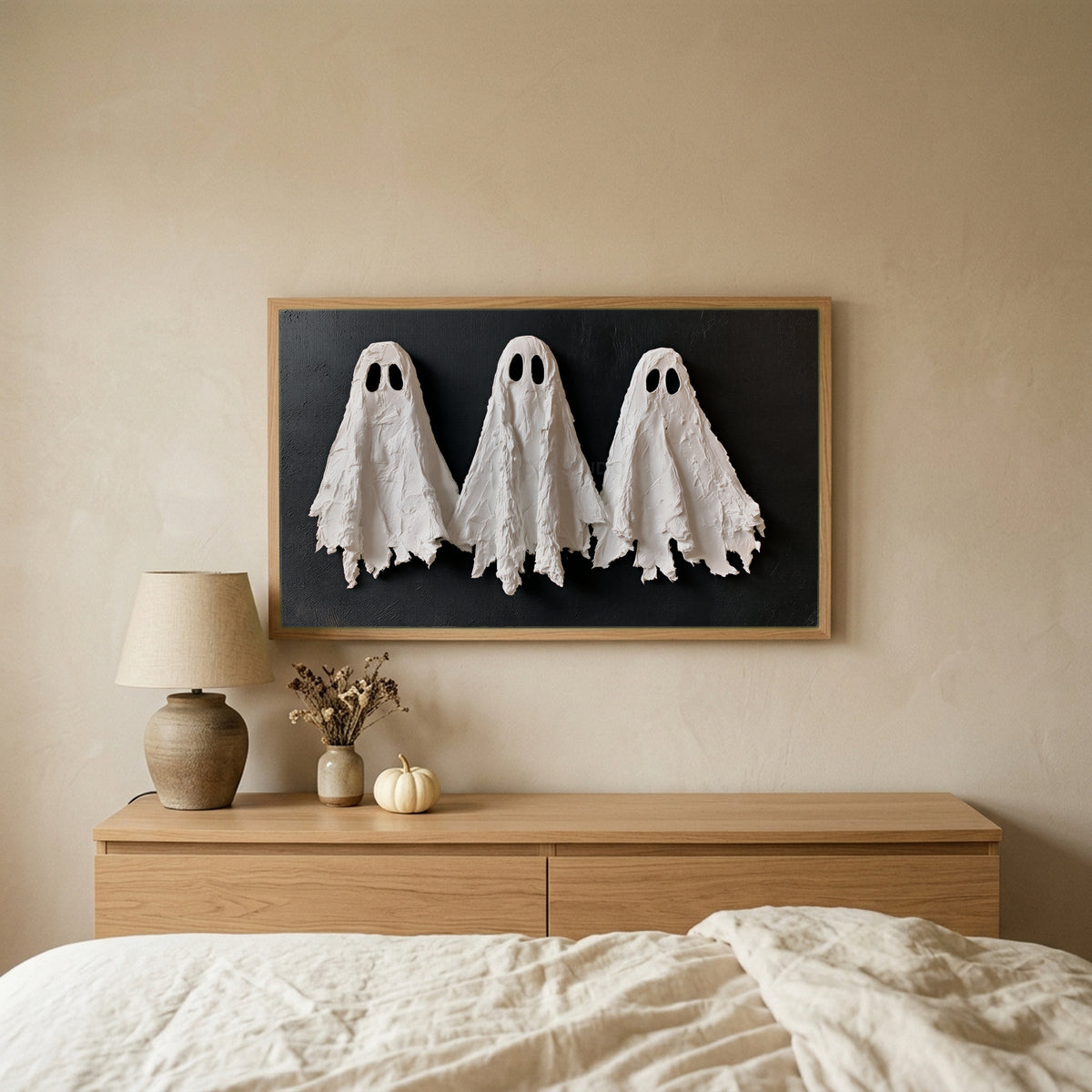 Textured ghosts TV art above an oak dresser in a calm bedroom