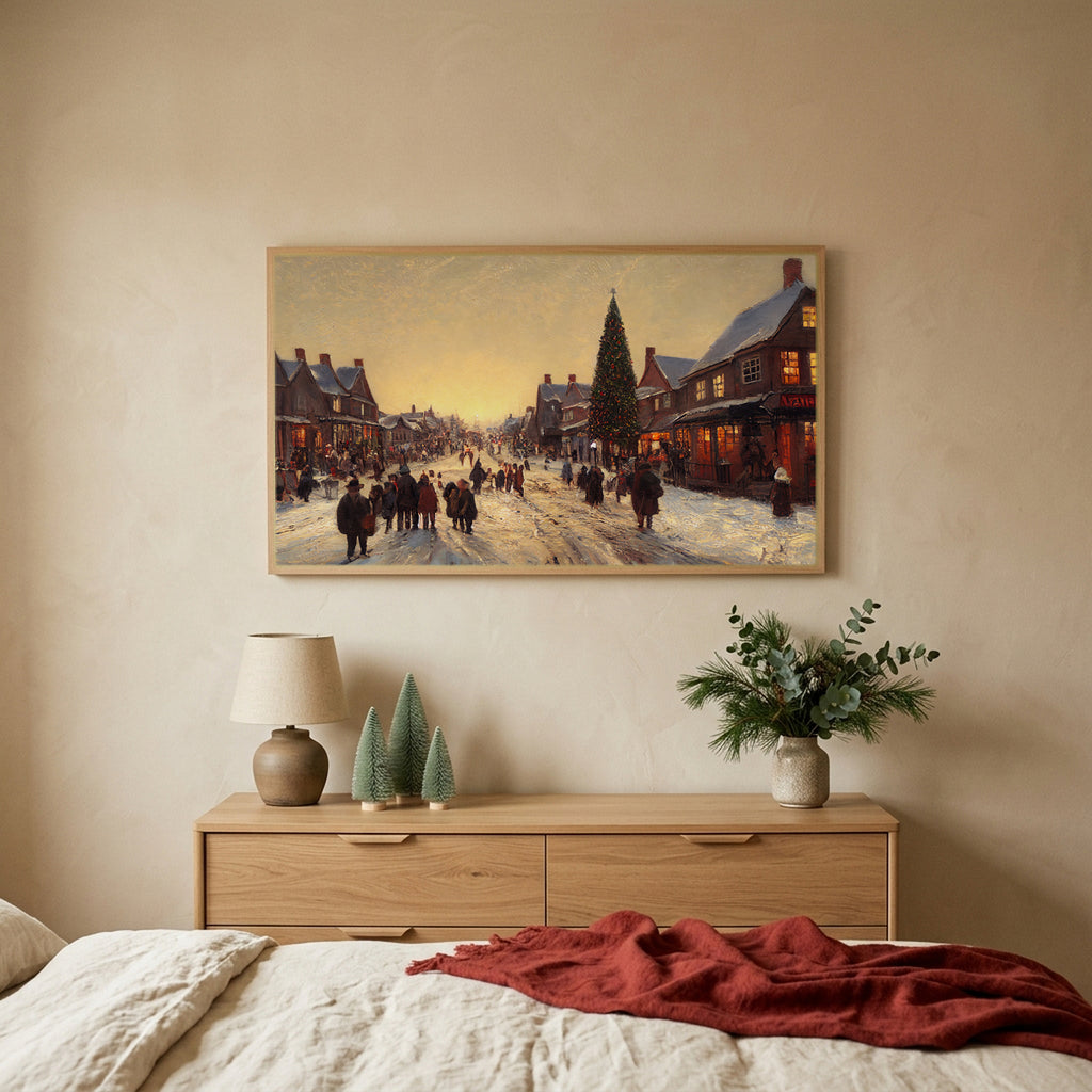 Village street with a big tree Christmas TV art above an oak dresser with small bottle-brush trees in a calm bedroom