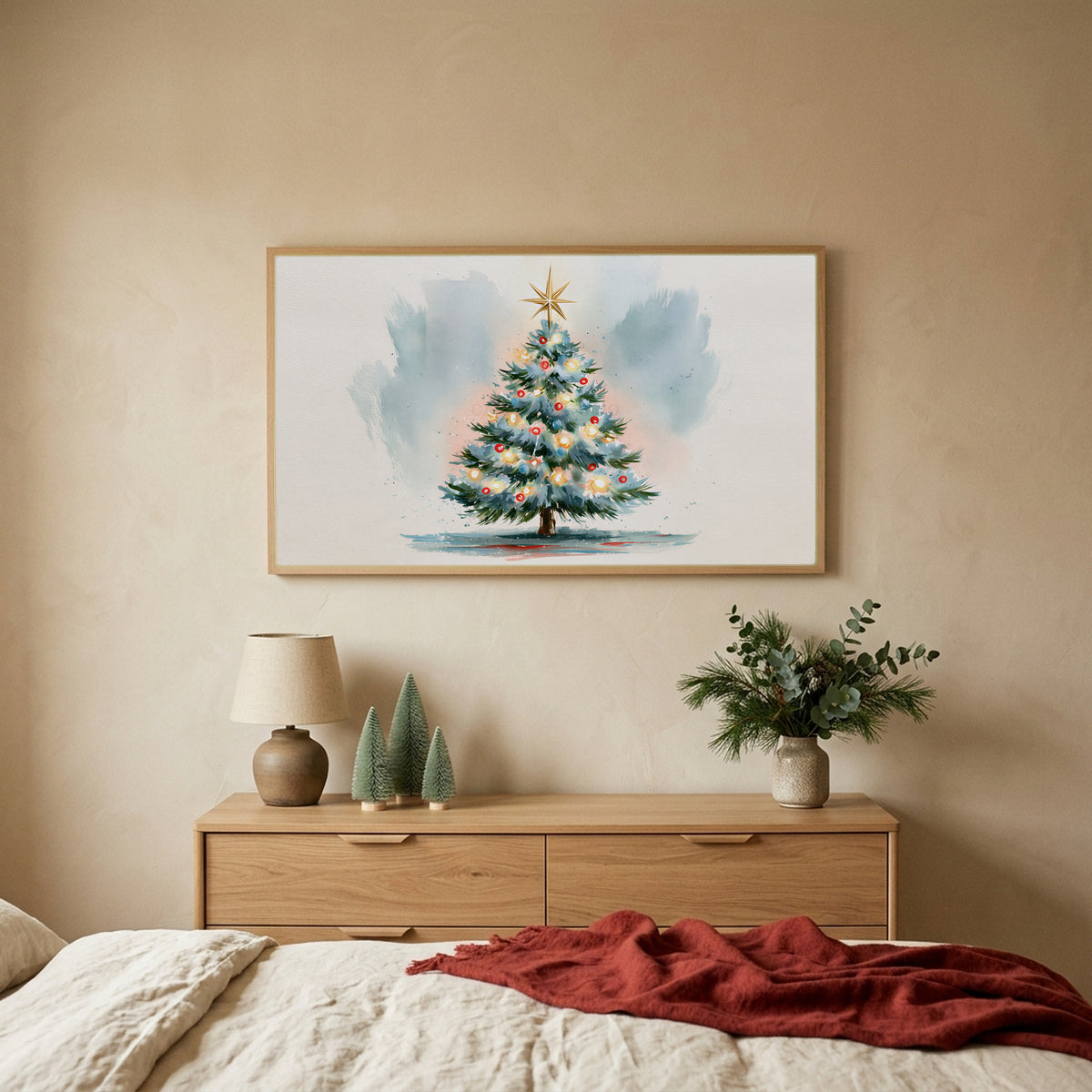 Watercolor Christmas tree TV art above an oak dresser with small bottle-brush trees in a calm bedroom