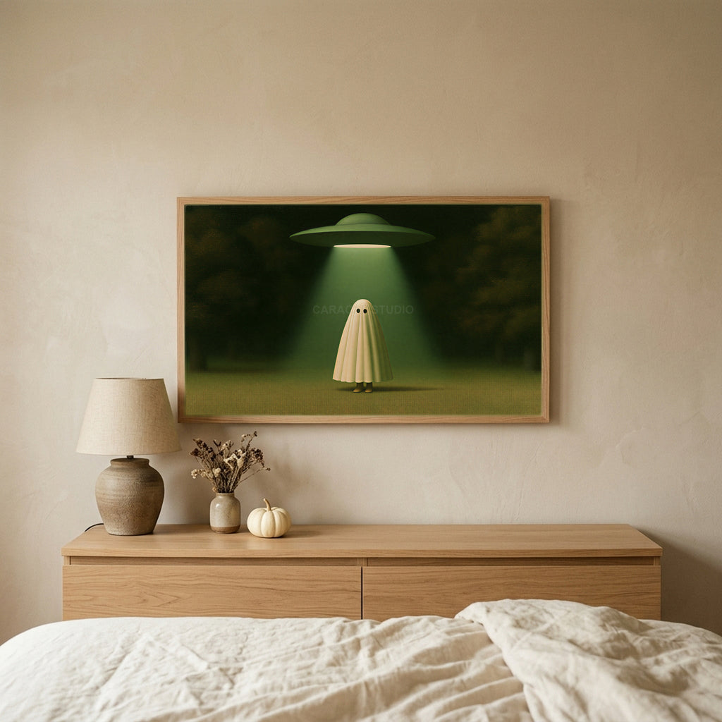 Ghost and UFO TV art above an oak dresser in a calm bedroom