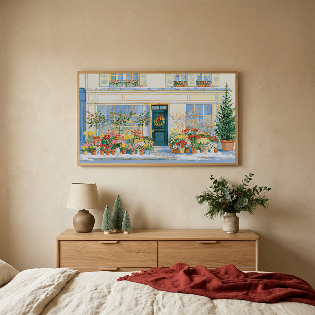 Paris flower shop Christmas TV art above an oak dresser with small bottle-brush trees in a calm bedroom