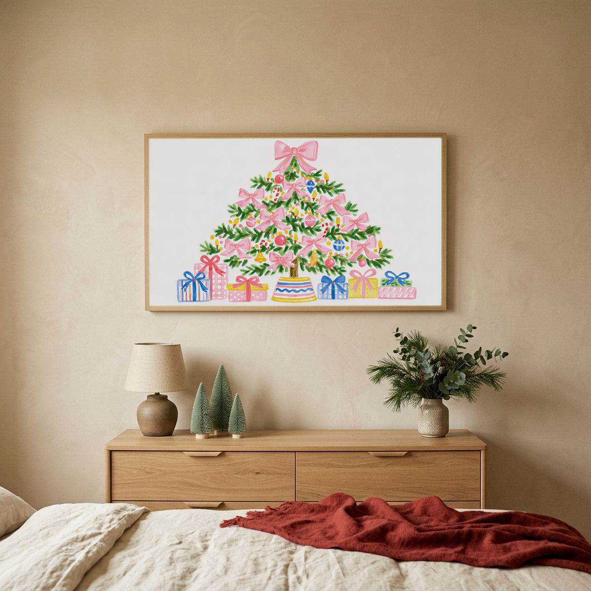 Pink bow Christmas tree Christmas TV art above an oak dresser with small bottle-brush trees in a calm bedroom