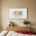 Christmas cookies TV art above an oak dresser with small bottle-brush trees in a calm bedroom