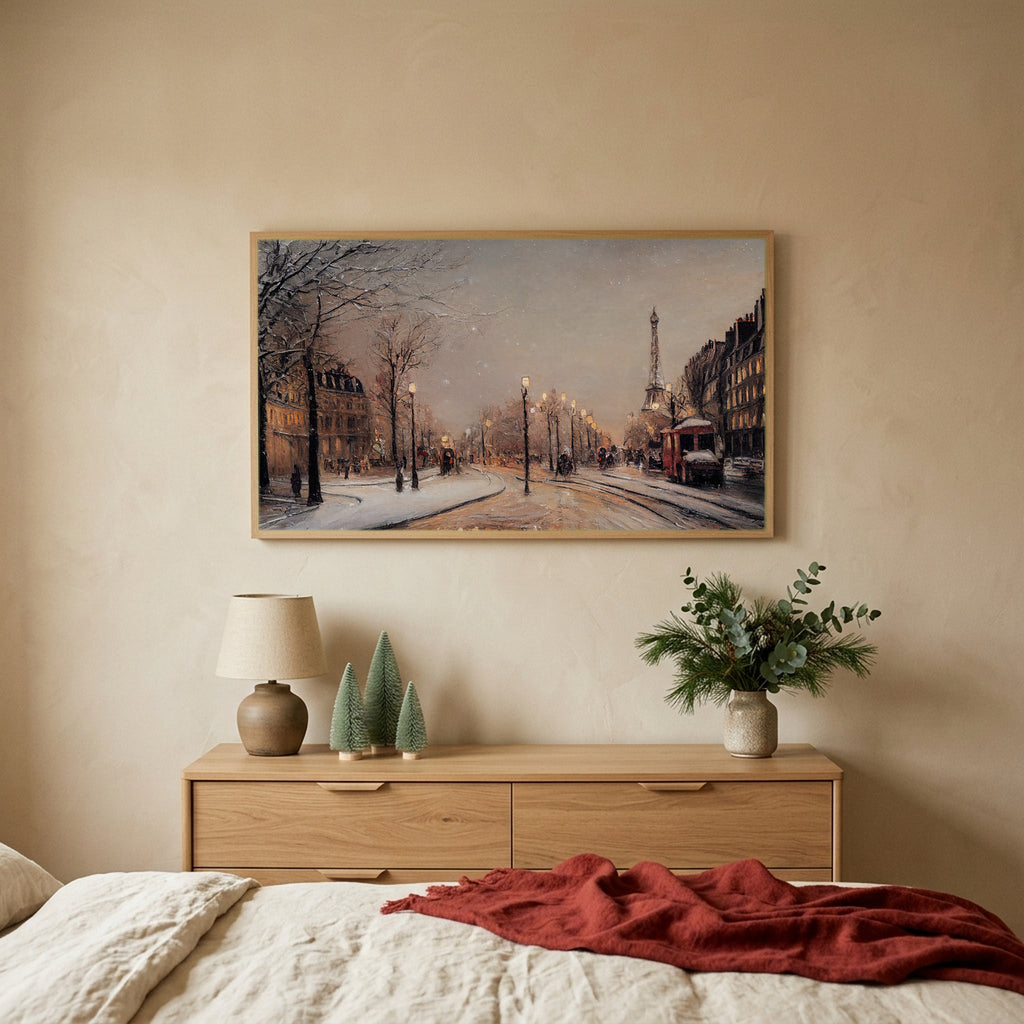 Paris street in snow Christmas TV art above an oak dresser with small bottle-brush trees in a calm bedroom