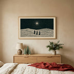 Three wise men TV art above an oak dresser with small bottle-brush trees in a calm bedroom