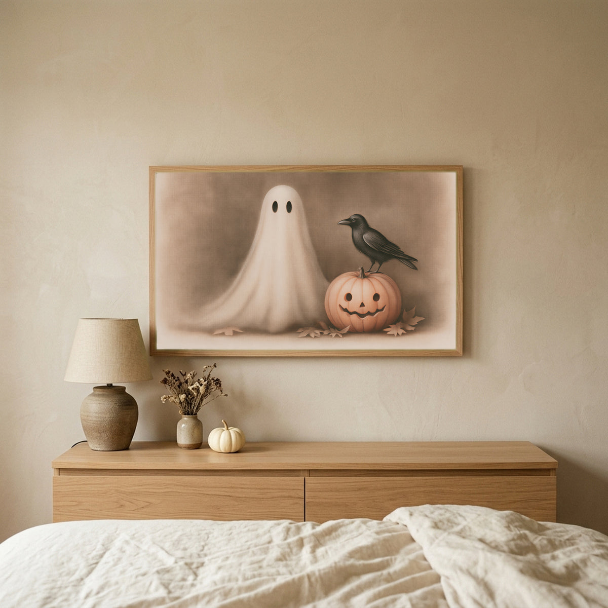 Ghost and crow Halloween TV art above an oak dresser in a calm bedroom